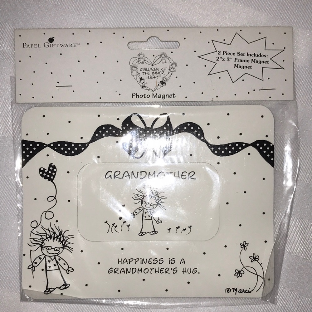 Photo magnet from papel giftware. “Happiness is a grandmother’s hug”.
